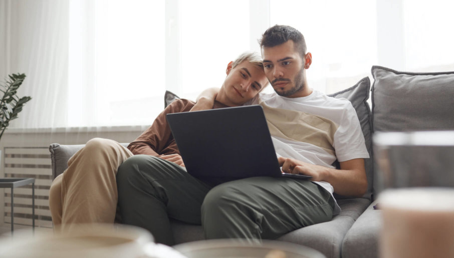 Couple watching videos on a laptop