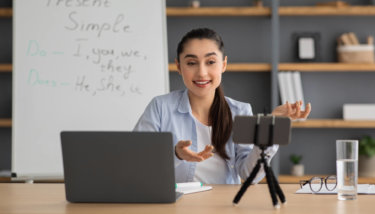 A video content creator records a video for an online course she is creating