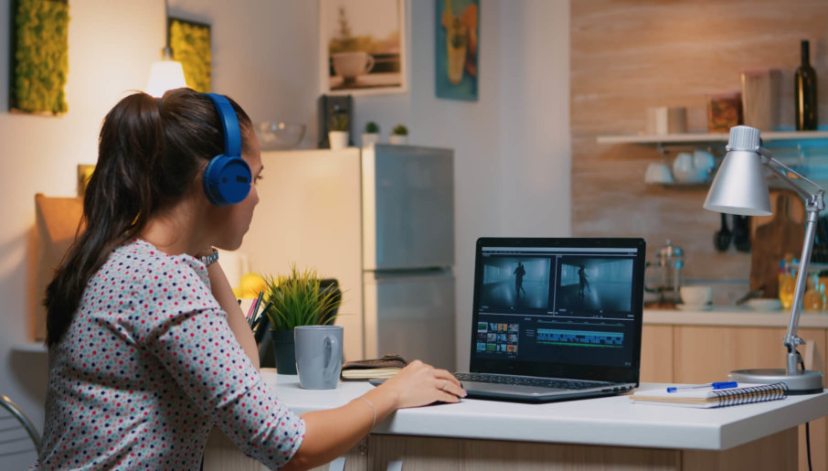 A woman researching online for the best video CMS options available today.