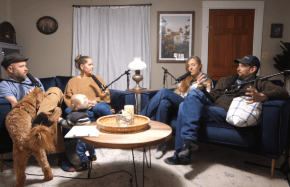 Photo of a group of people talking at a podcast.