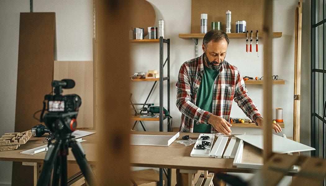 A man is creating an instructional video to upload to a Teachable alternative platform.