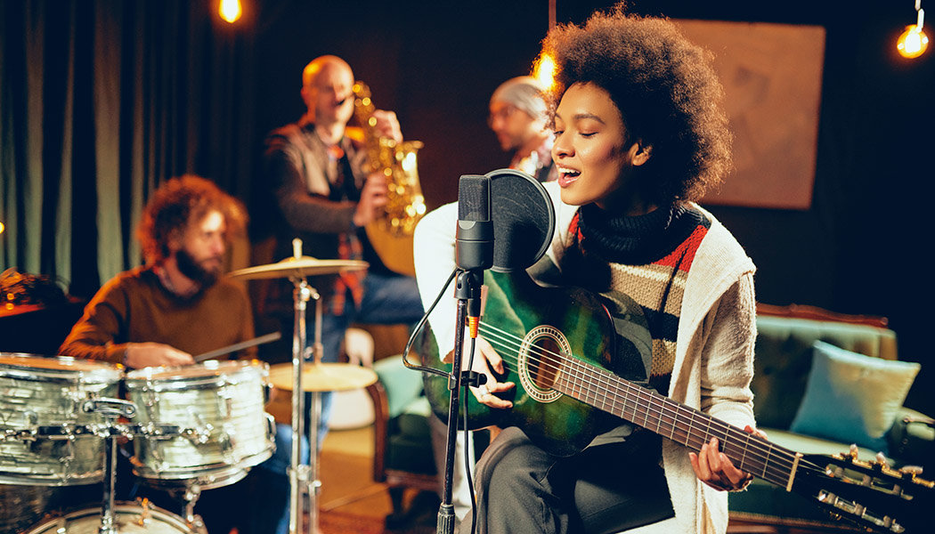 A band performs from the convenience of their studio after learning about live streaming concerts.