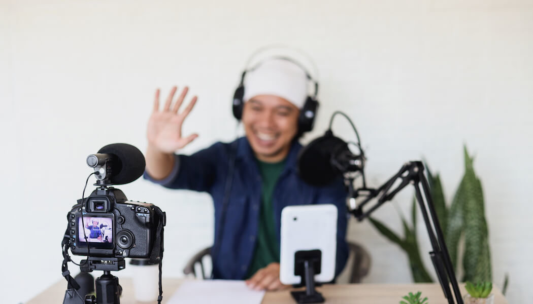 A man talks in front of a camera explaining how to make the most out of a hybrid YouTube marketing funnel for membership sites.