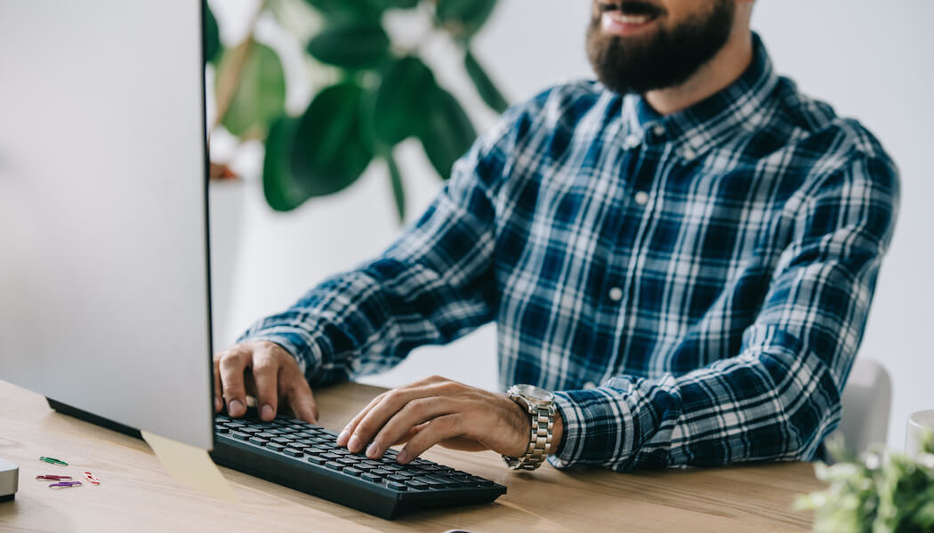 An image of a man learning how to practice membership site SEO.