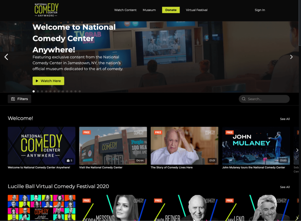 An image shows the video content library of the OTT business National Comedy Center Anywhere.