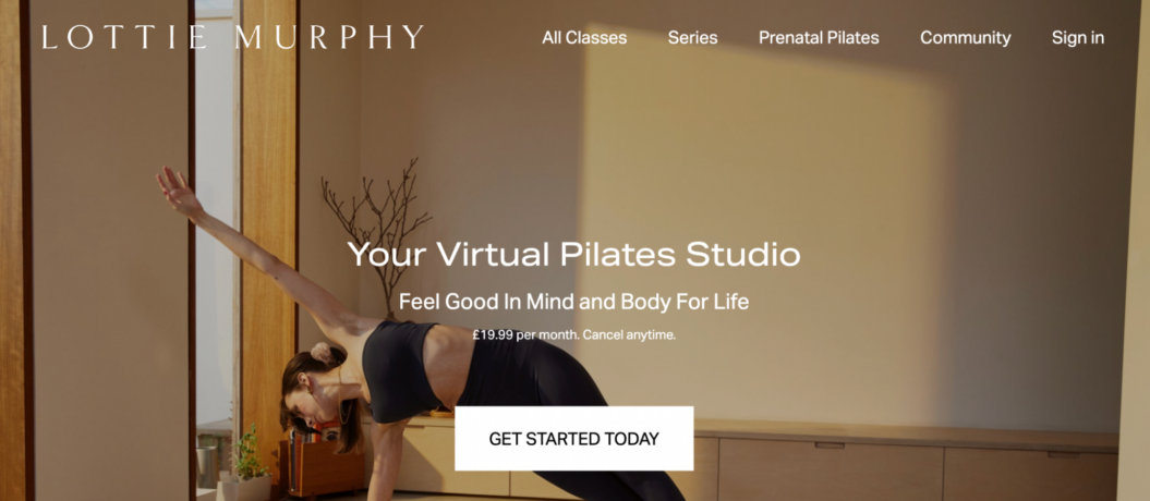 Female instructor demonstrating Pilates pose in a well-lit studio with wooden decor, promoting an online virtual Pilates class subscription.