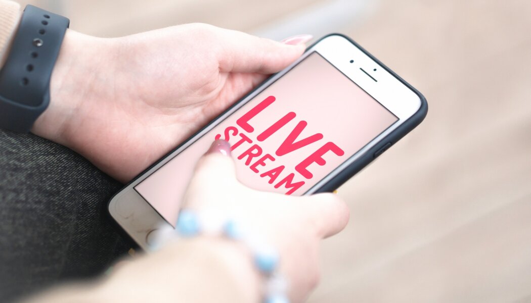 Live stream - woman holding a mobile phone