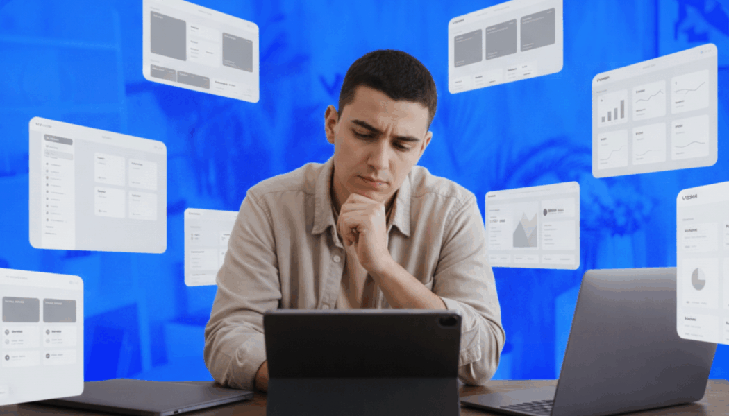 man sitting at computer building a business