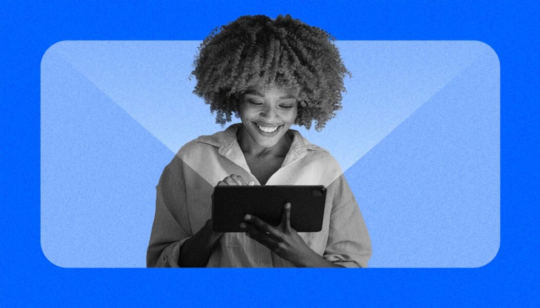 Woman looking at a tablet with a light emanating, stylized blue grain effects masking the image.